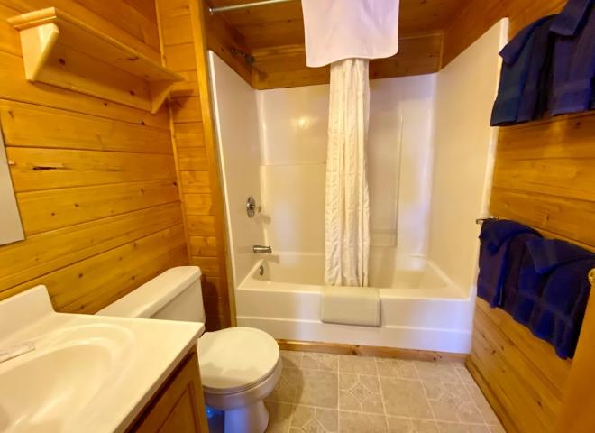 Bathroom with a standard tub/shower.