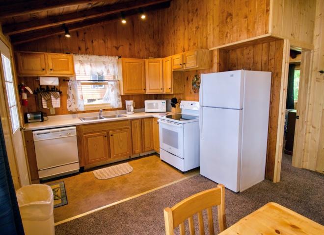 Kitchen with a refrigerator, stove, and dishwasher.