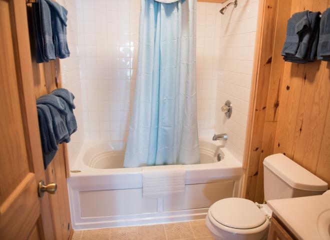 Upstairs bathroom with a standard tub/shower.