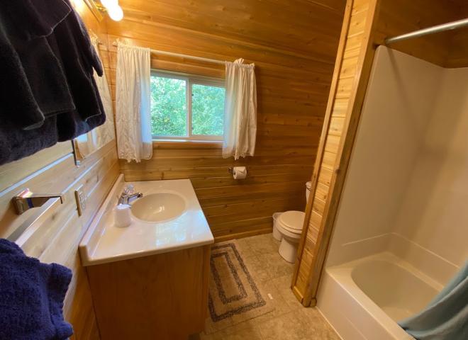 Upstairs bathroom with a standard tub/shower.