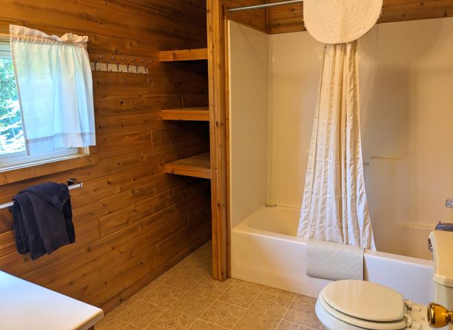 Upstairs bathroom with standard tub/shower.