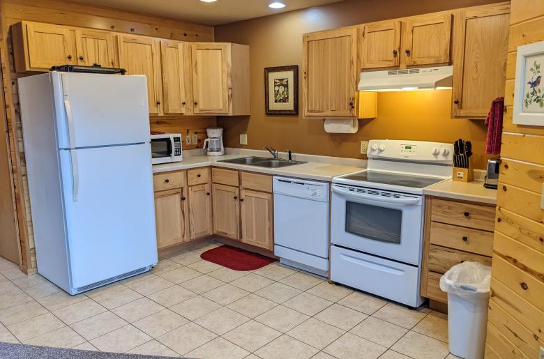 Kitchen with a refrigerator, stove, and dishwasher.