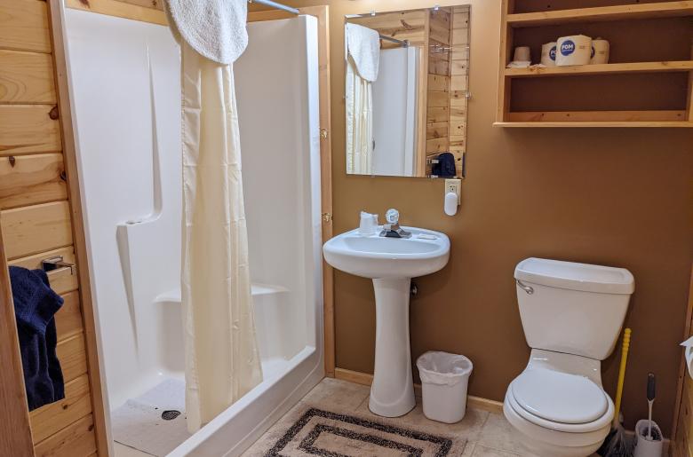 Main floor bathroom with wide door and easy access shower and sink.