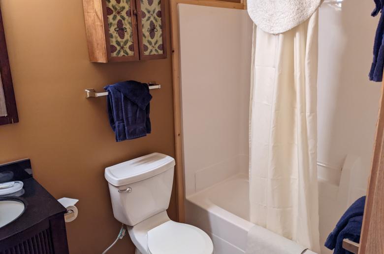 Upstairs bathroom with a standard tub/shower.