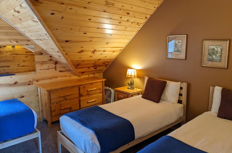 Upstairs bedroom with two XL twins and a regular twin.