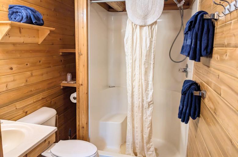 Main floor bathroom with a wide door and easy access shower and sink.