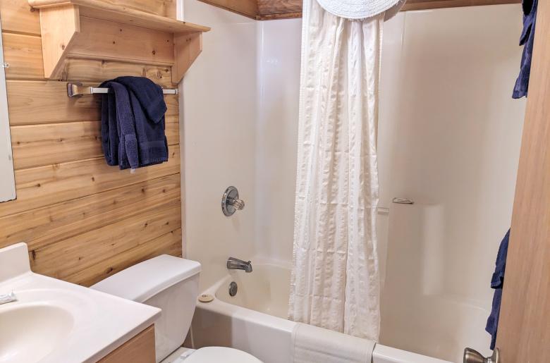 Main floor bathroom with a standard tub/shower.