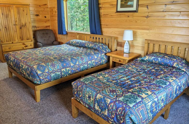Loft bedroom with a queen and twin bed.