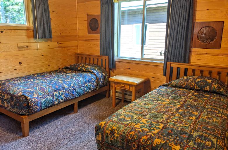 Main floor bedroom with two twin beds.