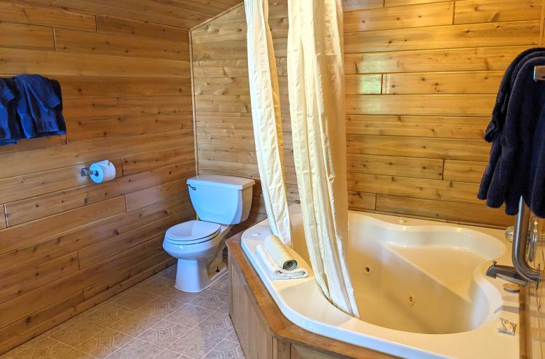 Loft bathroom with an oversized whirlpool tub/shower.