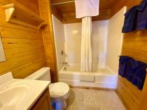Bathroom with a standard tub/shower.