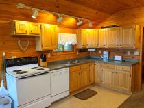 Kitchen with a refrigerator, stove, and dishwasher.