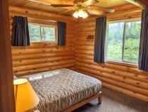 Main floor bedroom with a queen bed.