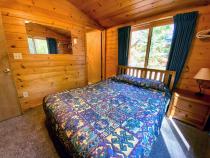 Master bedroom with queen size bed and ensuite bathroom.